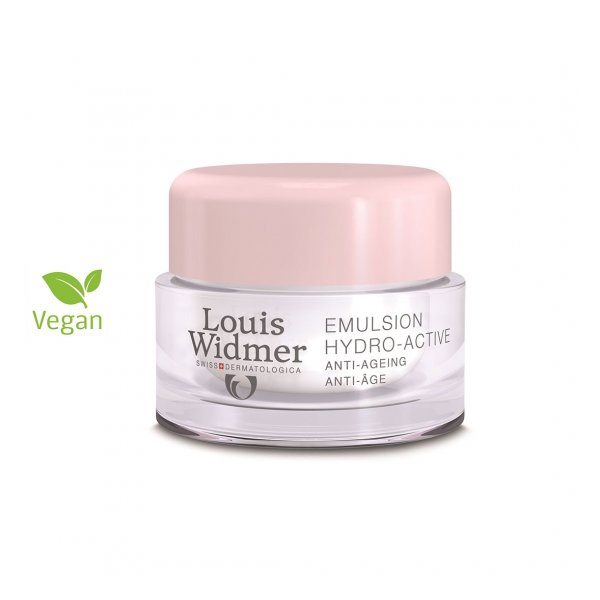 Die Verpackung einer veganen Hydro-Active Emulsion von Louis Widmer mit rosa Deckel und klarer Glasdose.