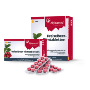 Preiselbeeren-Filmtabletten in Verpackungen, präsentiert mit roten, runden Tabletten in Blisterpackungen.