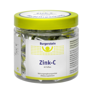 Durchsichtiger Kunststoffbehälter mit gelbem Deckel, gefüllt mit Zink-C Toffees von Burgerstein. Verpackungslabel sichtbar.