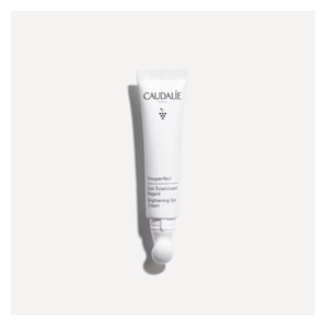 Eine weißtube mit einem rollenden Applikator für eine Aufhellende Augencreme von Caudalie.