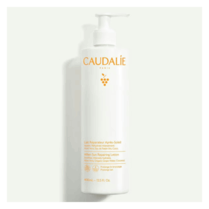 Weiße Flasche mit Spender für After-Sun Lotion von Caudalie, enthält Aloe Vera und Traubewasser.