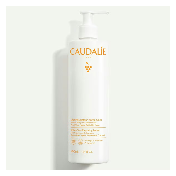 Weiße Flasche mit Spender für After-Sun Lotion von Caudalie, enthält Aloe Vera und Traubewasser.