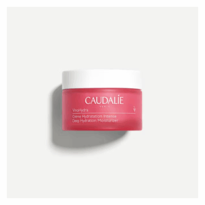 Rosa Cremebecher von Caudalie mit Deckel, auf dem Produktname und Beschreibung stehen.